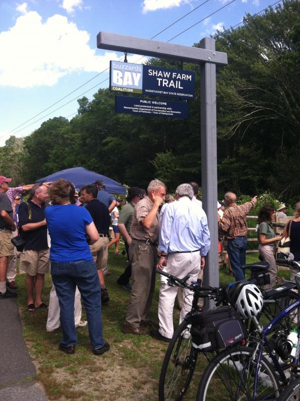 Officials and well-wishers gather at the Shaw Farm Trail head for a ribbon cutting ceremony. BY MATTHEW BERNAT